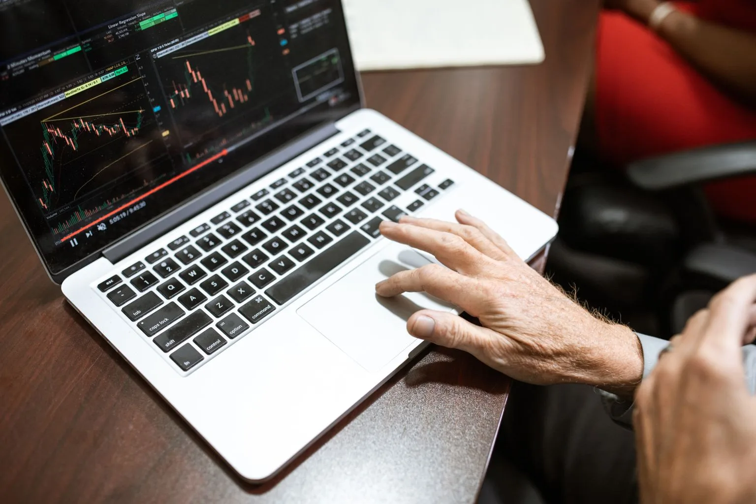 Trader reviewing historical forex charts on a laptop before running a backtest.