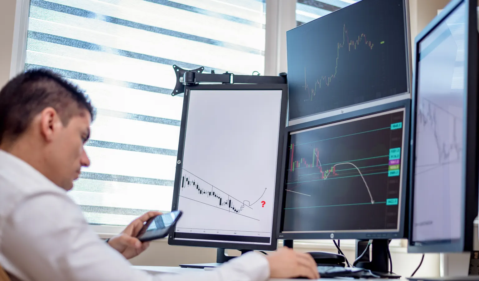 Trader analyzing backtest results and win rate on a laptop screen